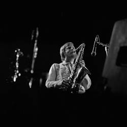 A person playing a saxophone

Description automatically generated