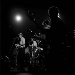 A group of people performing on stage

Description automatically generated
